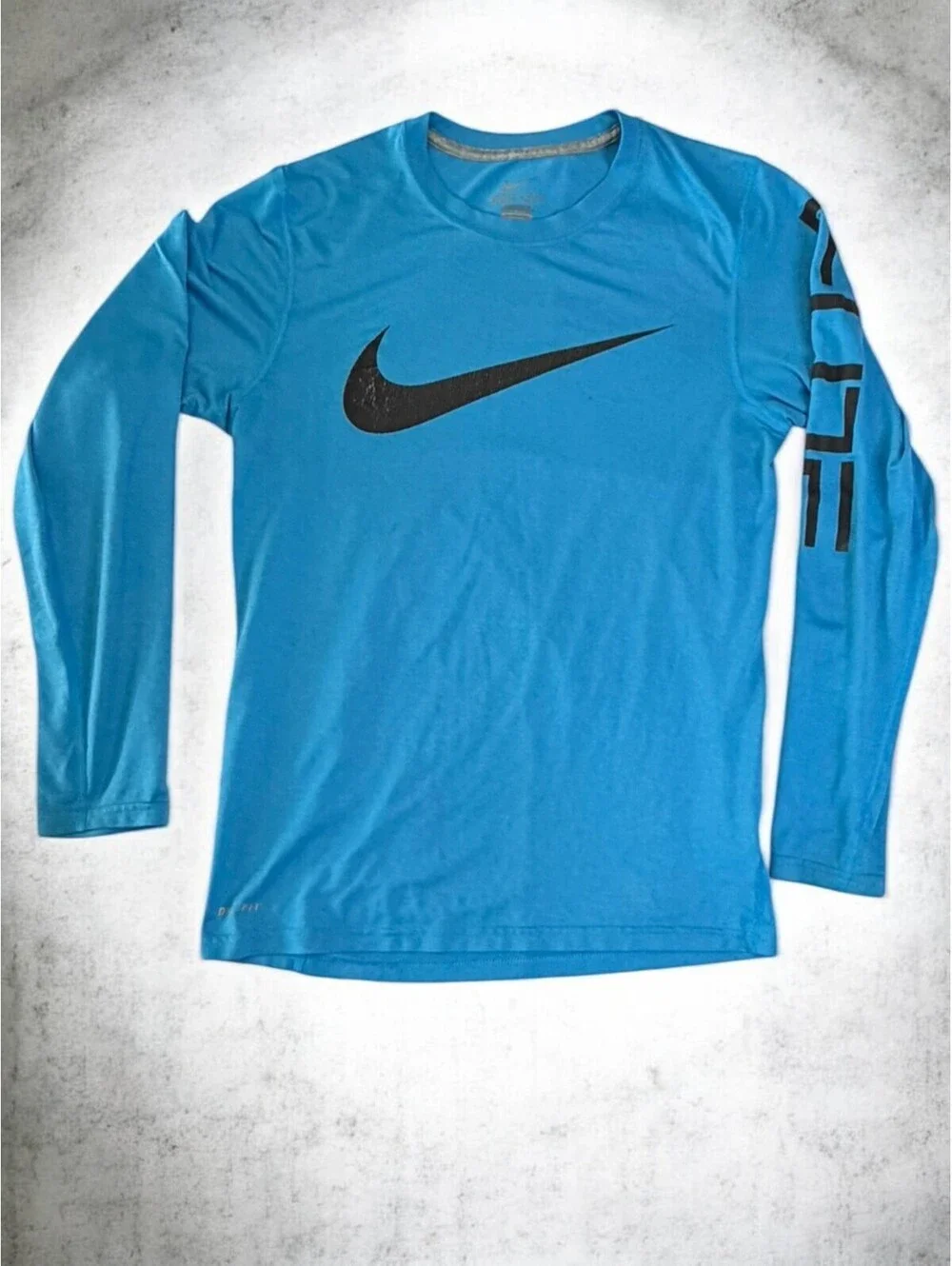 Nike Dri-FIT Men's Long Sleeve Blue Athletic Shirt with Black Swoosh and 'Elite'